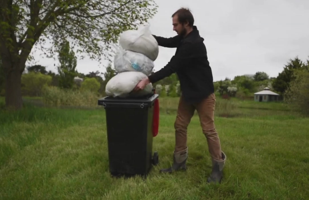 Load video: Watch EBC Wheelie Bin Locks in action. A man throws a full bin down a hill and the rubbish doesn&#39;t fall out. Cockatoos are trying to open the bin lids, but the locks are stopping them.